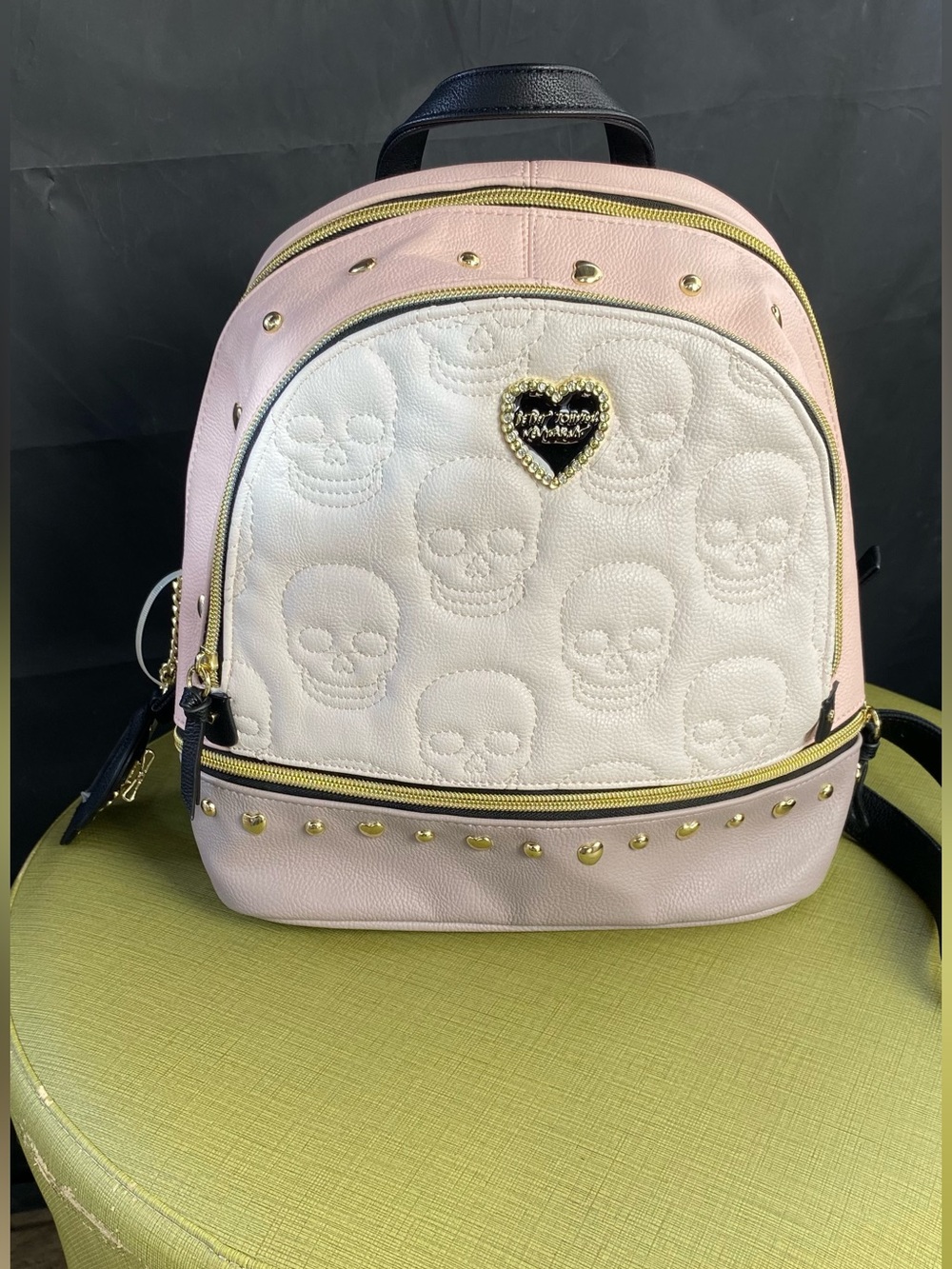 Betsey Johnson Pink and White Skull-Embossed Mini Backpack with Gold Accents